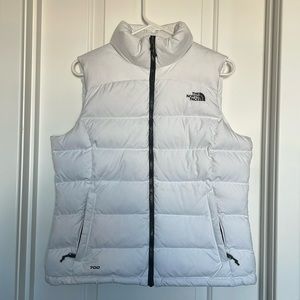 The North Face white puffer vest size Medium.